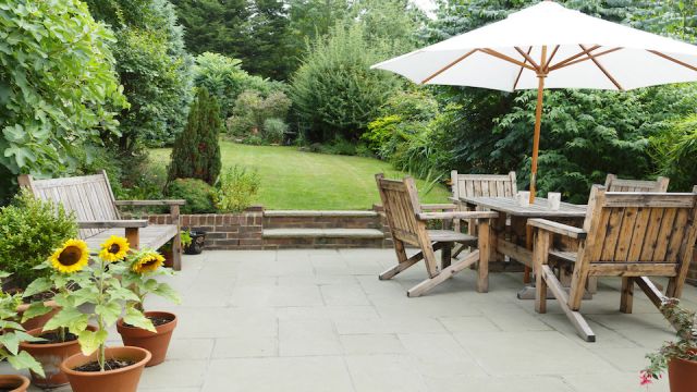 Patio with garden furniture and parasol